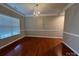 Formal dining room featuring hardwood floors, ample natural light, and chandelier at 3022 Hendricks Chapel Ln, Charlotte, NC 28216