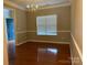 Elegant dining room with hardwood floors, chair rail, and a chandelier at 3022 Hendricks Chapel Ln, Charlotte, NC 28216