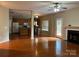 Spacious living room, open floor plan, hardwood floors, and access to kitchen at 3022 Hendricks Chapel Ln, Charlotte, NC 28216
