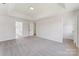 Large, inviting bedroom with neutral carpeting and adjacent bathroom at 3702 Arthur St, Indian Trail, NC 28079