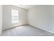 Neutral bedroom with plush carpeting and a bright window at 3702 Arthur St, Indian Trail, NC 28079