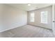 Cozy bedroom with carpet, two windows, and neutral walls at 3702 Arthur St, Indian Trail, NC 28079