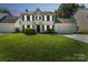 Charming two-story home at dusk with black shutters, tidy landscaping, and a well-manicured green lawn at 3702 Arthur St, Indian Trail, NC 28079
