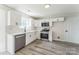A well-lit kitchen with stainless appliances, modern cabinets, and sleek countertops at 3702 Arthur St, Indian Trail, NC 28079