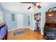 Exercise room with hardwood floors, bright natural lighting, exercise equipment, and closet at 4124 Oakwood Rd, Charlotte, NC 28269