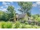 Pretty home with a deck area and abundant trees offering a secluded feel and lots of shade at 4124 Oakwood Rd, Charlotte, NC 28269