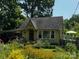 Charming home with a well-maintained yard and garden creates a beautiful curbside appeal at 4124 Oakwood Rd, Charlotte, NC 28269