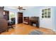 Home office with hardwood floors, natural lighting, and wood furnishings at 4124 Oakwood Rd, Charlotte, NC 28269