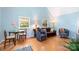 Lovely living room filled with natural light, hardwood floors, and a dining area at 4124 Oakwood Rd, Charlotte, NC 28269