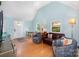 Sunlit living room featuring vaulted ceilings, hardwood floors, and a cozy seating arrangement at 4124 Oakwood Rd, Charlotte, NC 28269