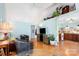 Bright living room with vaulted ceilings, a ceiling fan, and hardwood floors at 4124 Oakwood Rd, Charlotte, NC 28269