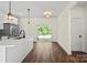 Kitchen featuring a center island, stainless steel appliances, and sliding doors to the backyard at 5328 Oaktree Dr, Gastonia, NC 28052