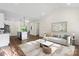 Open-concept living room and kitchen area with modern decor and plenty of natural light at 5328 Oaktree Dr, Gastonia, NC 28052