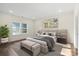 Bedroom with neutral tones, an upholstered headboard, soft carpet and large windows at 5328 Oaktree Dr, Gastonia, NC 28052