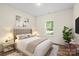 Comfortable bedroom with neutral decor, a soft bed, and plenty of natural light from the window at 5328 Oaktree Dr, Gastonia, NC 28052