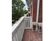 Welcoming balcony with red brick and wooden flooring, creating a peaceful outdoor retreat at 6112 Creft Cir, Indian Trail, NC 28079