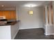 Open floor plan living room features hardwood floors and updated lighting at 6112 Creft Cir, Indian Trail, NC 28079