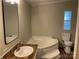 Well-lit bathroom featuring a garden tub, wood-style floors, and a modern vanity at 6218 Old Pageland Marshville Rd, Marshville, NC 28103