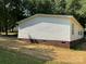 Exterior of home with vinyl siding and brick foundation at 6218 Old Pageland Marshville Rd, Marshville, NC 28103