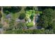 Detailed aerial view of home site showing mature trees and the surrounding neighborhood at 6616 Woodlawn Ln, Indian Trail, NC 28079