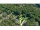 Aerial view of home site surrounded by mature trees, with property lines clearly visible at 6616 Woodlawn Ln, Indian Trail, NC 28079
