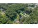 Expansive aerial view of a lush lot surrounded by mature trees, with home site outlined at 6616 Woodlawn Ln, Indian Trail, NC 28079