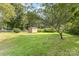 Spacious backyard featuring a storage shed and lush green grass at 6616 Woodlawn Ln, Indian Trail, NC 28079