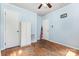 Well-lit bedroom featuring hardwood floors, blue walls, and two closets at 6616 Woodlawn Ln, Indian Trail, NC 28079
