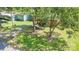 Quaint home with mature trees and a well-maintained front yard, offering a warm and inviting curb appeal in a serene neighborhood at 6616 Woodlawn Ln, Indian Trail, NC 28079
