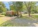 Charming brick home with a well-maintained front yard and mature trees at 6616 Woodlawn Ln, Indian Trail, NC 28079