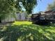 Large, well-maintained backyard with lush grass, a deck, a shed, and a privacy fence; perfect for recreation at 707 Regency Dr, Charlotte, NC 28211