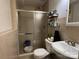 Modern bathroom with tiled shower, toilet, and corner sink, designed for comfort and convenience at 707 Regency Dr, Charlotte, NC 28211