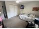 Functional bedroom features a twin bed, neutral walls, carpet and a ceiling fan at 707 Regency Dr, Charlotte, NC 28211