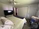 Bright bedroom with carpet, queen bed, and a double closet at 707 Regency Dr, Charlotte, NC 28211