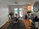 Cozy breakfast area features a round wooden table, seating for four, and easy access to the kitchen and outdoor patio at 707 Regency Dr, Charlotte, NC 28211