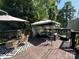 Spacious deck with a gazebo, seating and grill, perfect for outdoor entertainment and relaxation at 707 Regency Dr, Charlotte, NC 28211