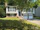 Charming two-story home with an attached two-car garage and a well-maintained lawn at 707 Regency Dr, Charlotte, NC 28211