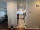 Galley kitchen featuring modern stainless steel appliances and white cabinetry with granite countertops at 707 Regency Dr, Charlotte, NC 28211
