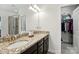 Bathroom with granite countertops and a view into the walk-in closet and a glass shower at 8275 Normandy Rd, Denver, NC 28037