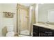 Bathroom features a glass-enclosed shower, granite countertop vanity, and modern fixtures at 8275 Normandy Rd, Denver, NC 28037