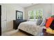 Inviting bedroom featuring a large window offering green outdoor views for a serene retreat at 8275 Normandy Rd, Denver, NC 28037