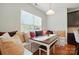 Bright dining nook featuring built-in bench seating, natural light, and wood floors at 8275 Normandy Rd, Denver, NC 28037