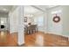 Elegant dining room with hardwood floors, white trim, and a chandelier, perfect for entertaining guests at 8275 Normandy Rd, Denver, NC 28037