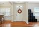 Bright foyer with hardwood flooring, white trim, and decorative accents, creating a welcoming entrance at 8275 Normandy Rd, Denver, NC 28037
