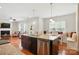 Open concept kitchen with granite counters, stainless appliances, and an adjacent dining area at 8275 Normandy Rd, Denver, NC 28037