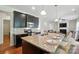 Modern kitchen features granite countertops, stainless steel appliances, and a breakfast bar at 8275 Normandy Rd, Denver, NC 28037