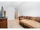 Well-lit living room featuring comfortable seating, neutral colors, and a view of the entry door at 8275 Normandy Rd, Denver, NC 28037
