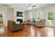 Comfortable living room features fireplace, hardwood floors, and natural light at 8275 Normandy Rd, Denver, NC 28037