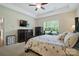 Spacious main bedroom featuring a tray ceiling, and an abundance of natural light at 8275 Normandy Rd, Denver, NC 28037
