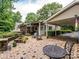 The home features a backyard with a fire pit, patio seating, and landscaping, perfect for outdoor living at 1047 Honeybee Trl, Fort Mill, SC 29715